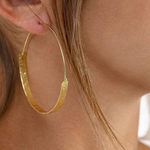 Orecchini cerchio semipiatto