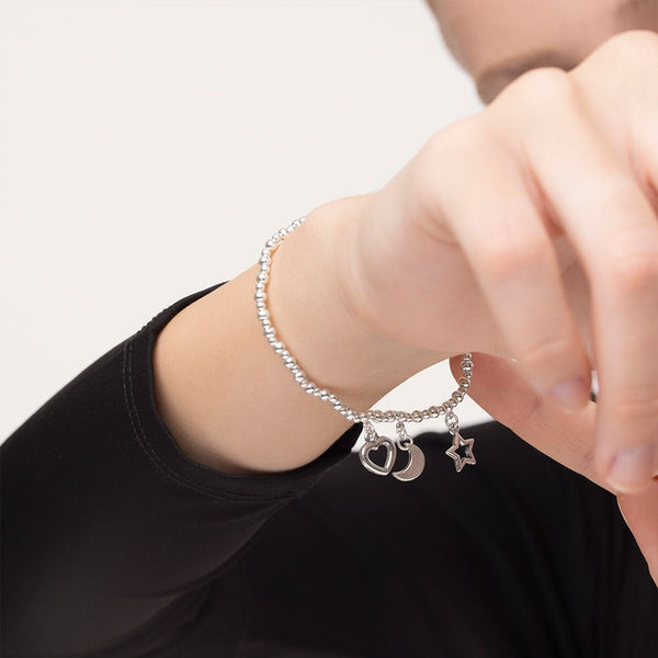 Bracciale elastico tris pendenti luna/cuore/stella