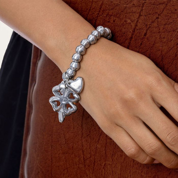 Bracciale elastico sfere cuore/quadrifoglio